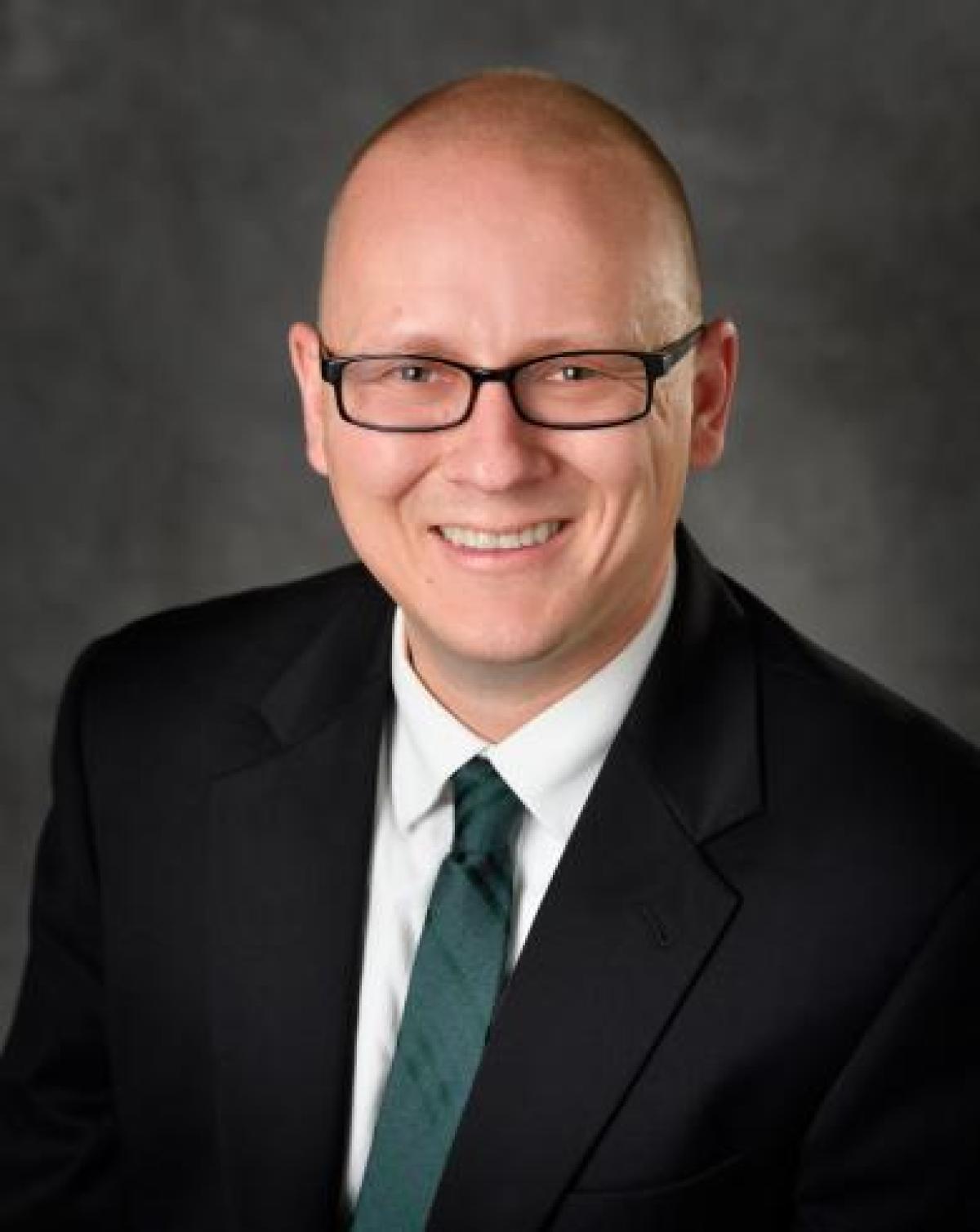 Professional headshot of Peter Savolainen