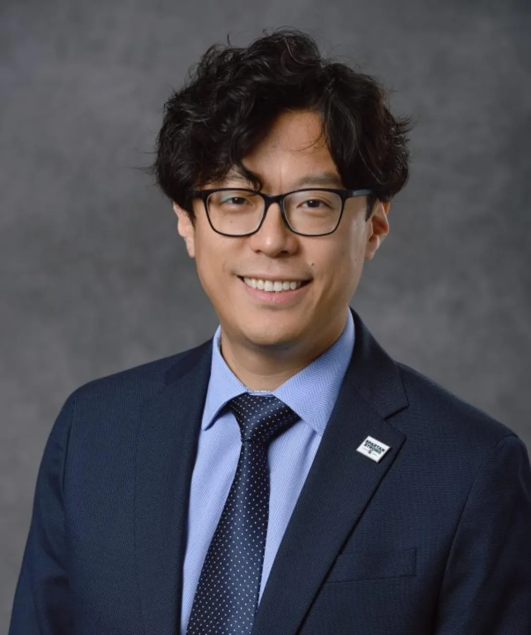 Professional headshot of Yiming Deng